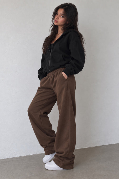 Model wearing Brown Sweats